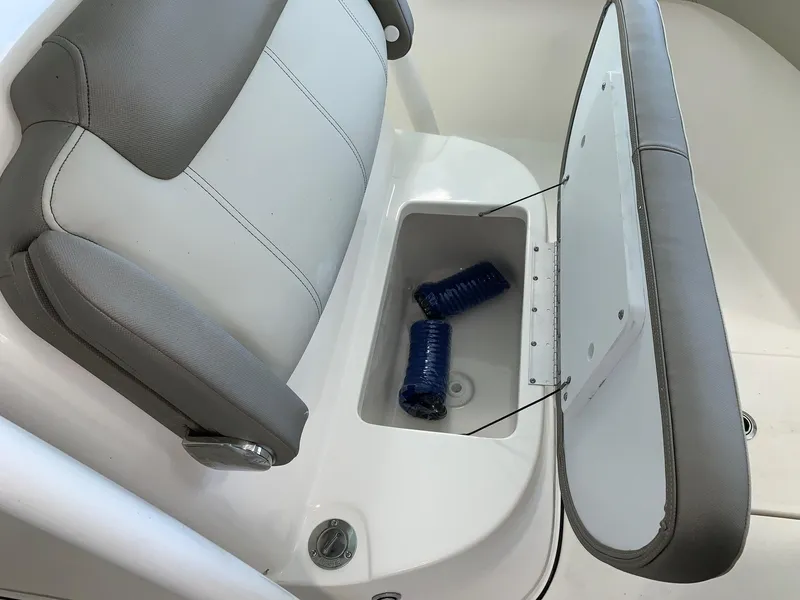 Slide: The Image of 2024 Key West 263 FS boat seat with storage compartment. - 17