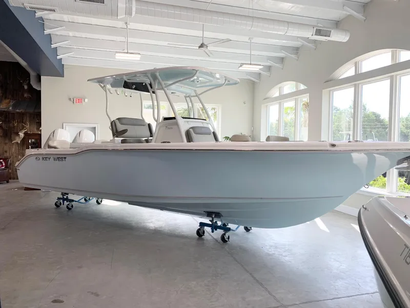 Slide: The Image of 2024 Key West 263 FS boat displayed indoors. - 2