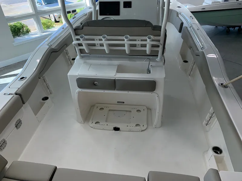 Slide: The Image of 2024 Key West 263 FS boat interior with seating and storage compartments. - 6