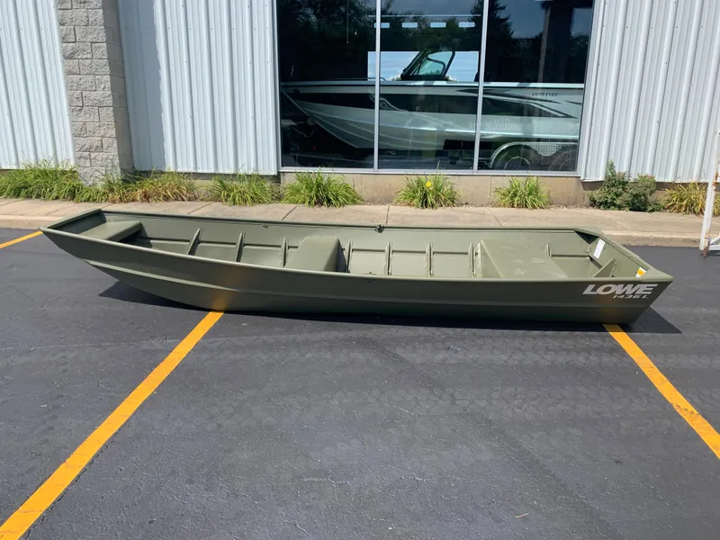 Slide: The Image of 2024 Lowe L1436 boat in parking lot, green color, side view. - 2