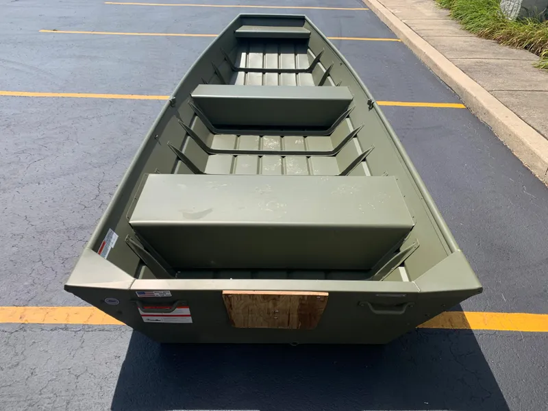 Slide: The Image of 2024 Lowe L1436 boat in a parking lot, showcasing its interior and seating. - 3