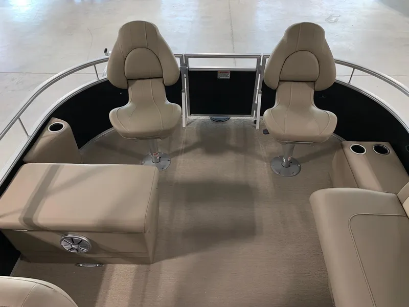 Slide: The Image of 2024 Starcraft LX22 F boat interior with beige seating and carpet. - 7