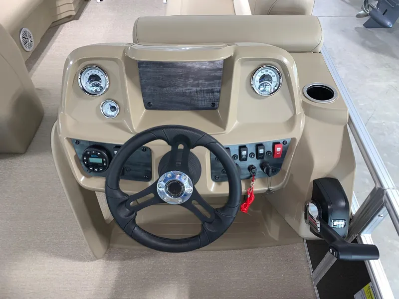 Slide: The Image of 2024 Starcraft LX22 F boat dashboard with steering wheel and control panel. - 10