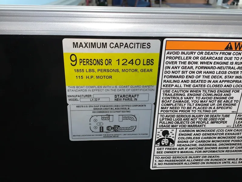 Slide: The Image of 2024 Starcraft LX22 F maximum capacities label, 9 persons or 1240 lbs, 115 H.P. motor. - 14