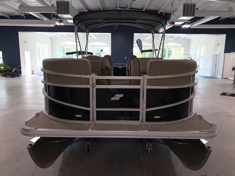 Slide: The Image of 2024 Starcraft LX22 F pontoon boat in showroom. - 3