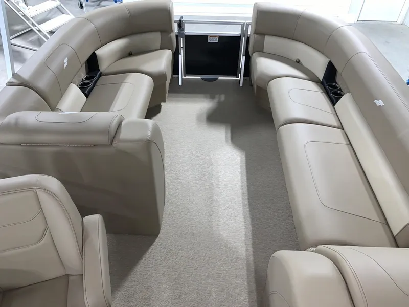 Slide: The Image of 2024 Starcraft LX22 R pontoon boat interior with beige seating. - 13