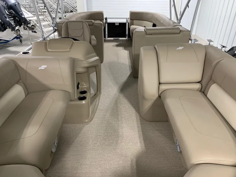 Slide: The Image of 2024 Starcraft LX22 R pontoon boat interior with beige seating. - 16