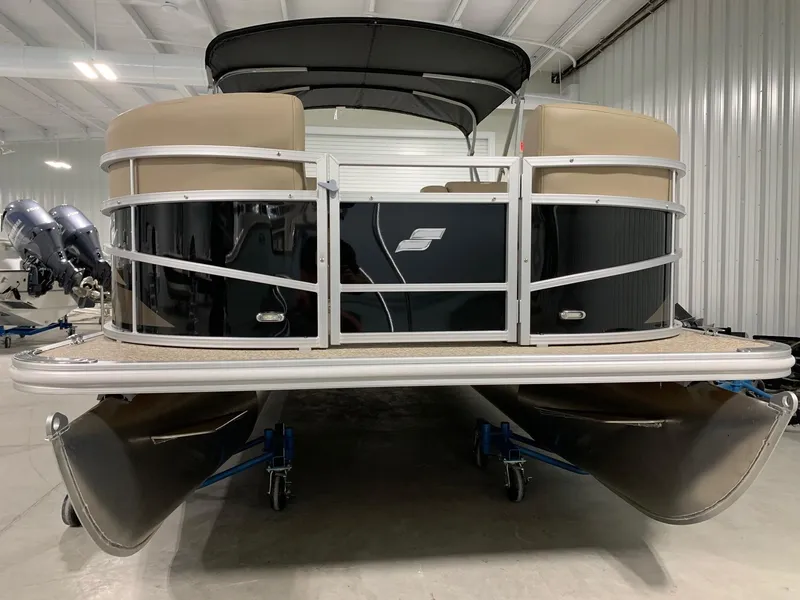 Slide: The Image of 2024 Starcraft LX22 R pontoon boat in a showroom. - 5