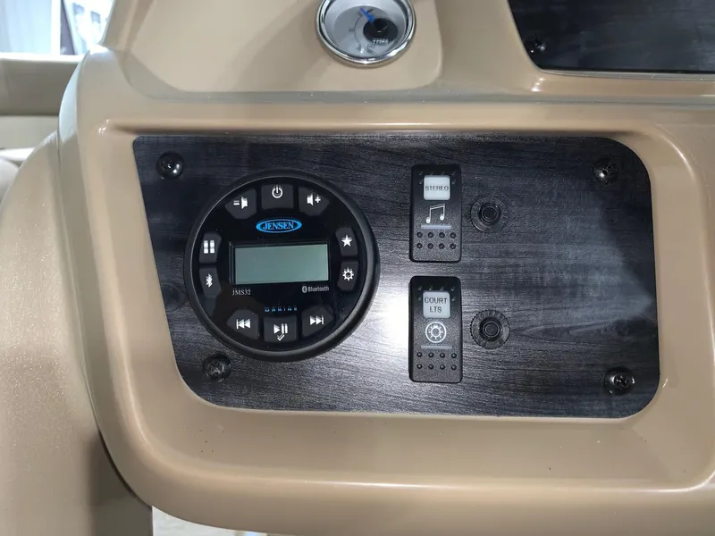 Slide: The Image of 2024 Starcraft LX22 R boat dashboard with control panel and switches. - 8