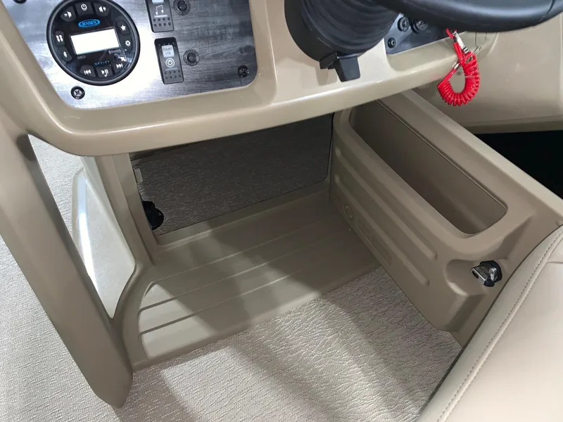 Slide: The Image of 2024 Starcraft LX22 R boat dashboard and storage compartment. - 9