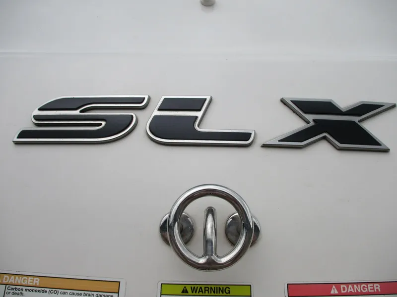 Slide: The Image of Sea Ray 210 SLX 2013 with SLX logo and warning labels. - 20