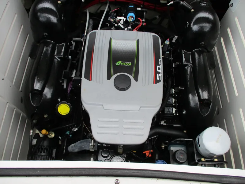 Slide: The Image of The engine compartment of a 2013 Sea Ray 210 SLX with a 5.0-liter engine. - 18