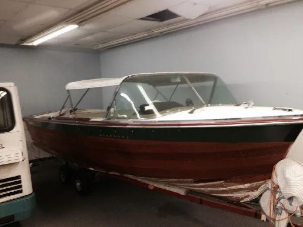 Slide: The Image of 1960 Century Coronado boat with wooden hull in indoor storage. - 4