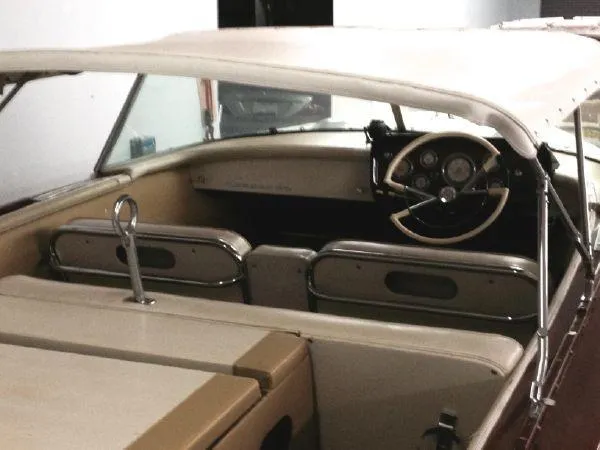 Slide: The Image of 1960 Century Coronado boat interior with classic steering wheel and seating. - 8