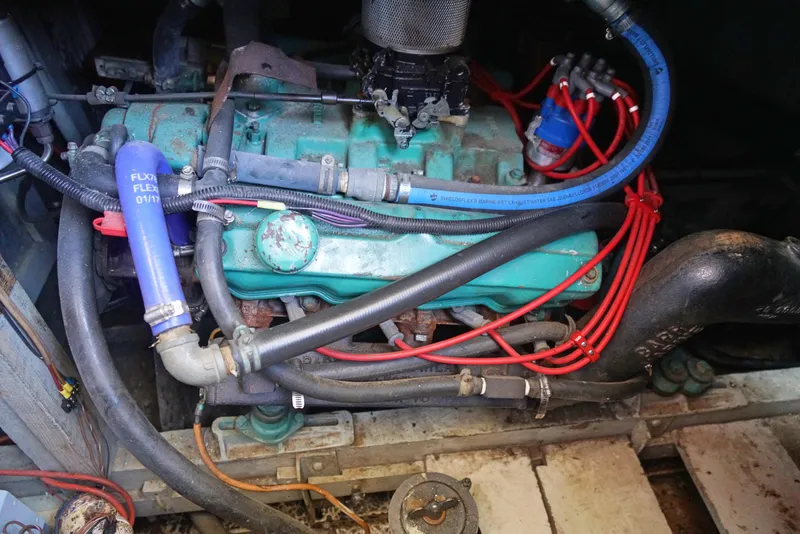 Slide: The Image of 1962 Chris-Craft Roamer 36 engine compartment with visible wiring and hoses. - 15
