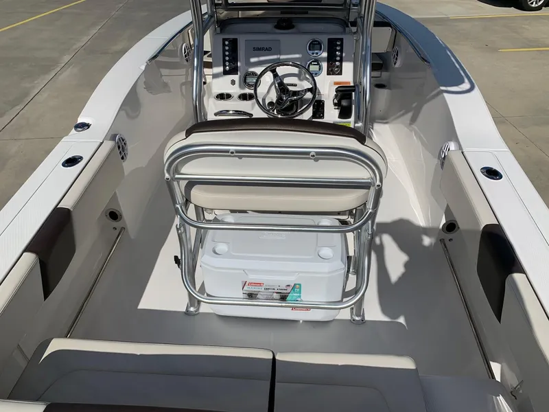 Slide: The Image of 2024 Robalo R202 Explorer boat interior with helm station and seating. - 10