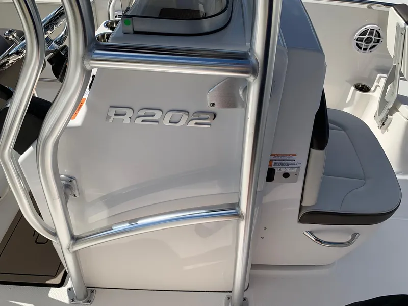 Slide: The Image of 2024 Robalo R202 Explorer boat interior with seating and console. - 16