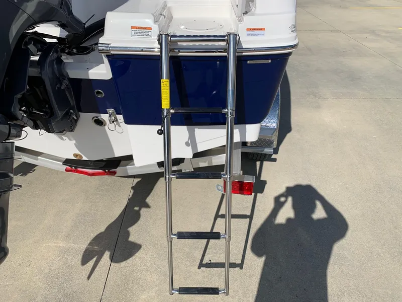 Slide: The Image of 2024 Robalo R202 Explorer boat with extended swim ladder. - 8