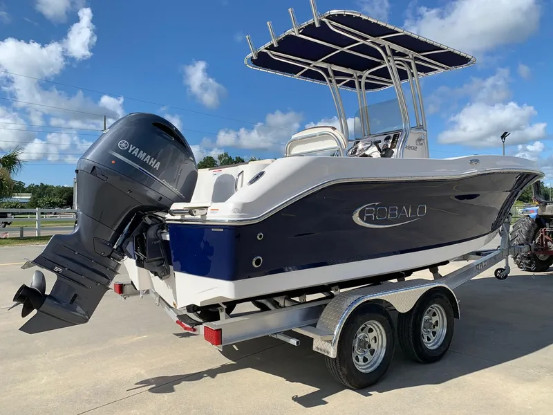 Slide: The Image of 2024 Robalo R202 Explorer boat with Yamaha outboard motor on a trailer. - 4