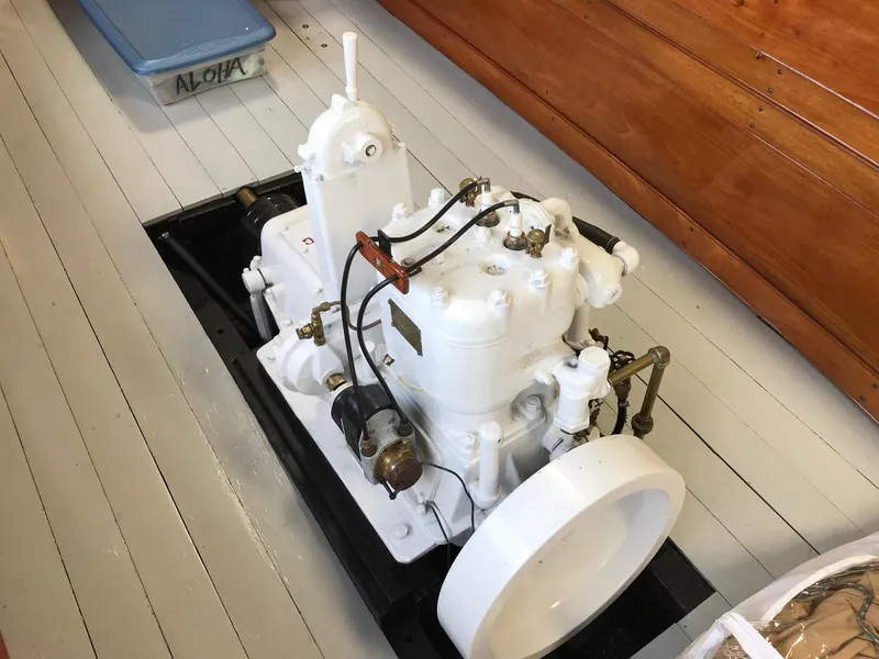 Slide: The Image of 1905 New York Launch model 20 engine on a wooden boat deck. - 4