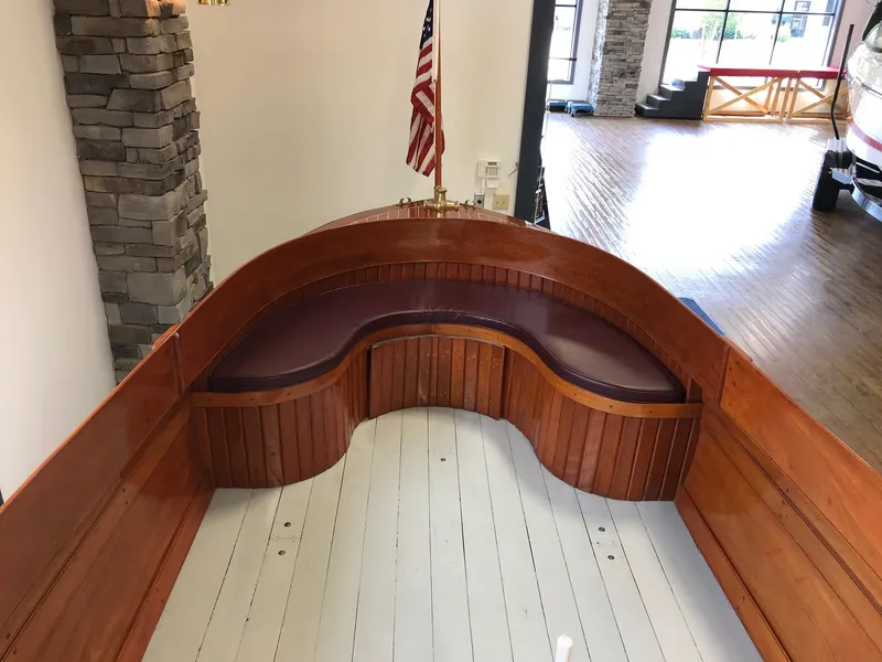 Slide: The Image of Vintage 1905 New York Launch 20 boat interior with wooden seating and American flag. - 5