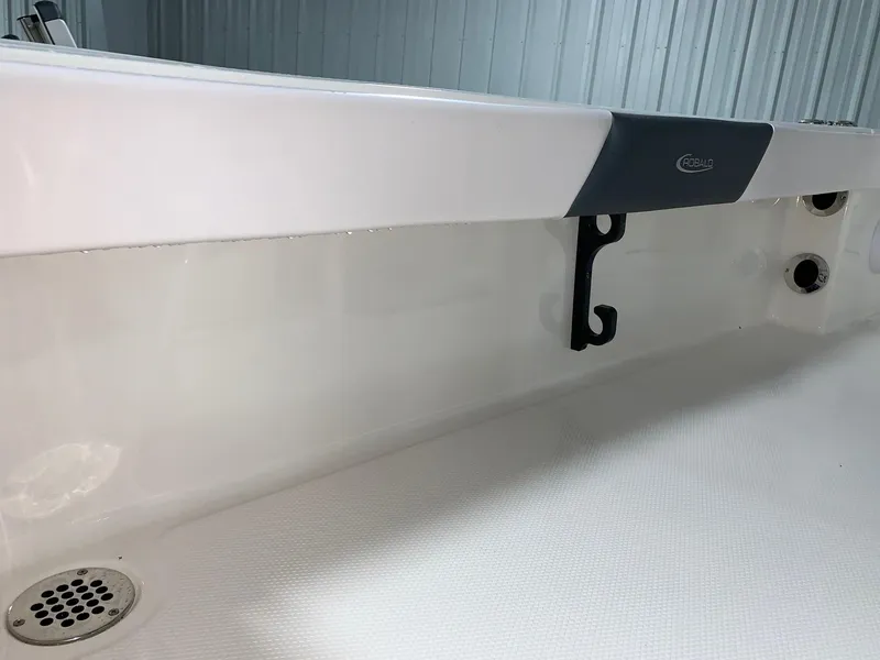 Slide: The Image of 2024 Robalo 226 Cayman boat interior detail with drain and hook. - 13