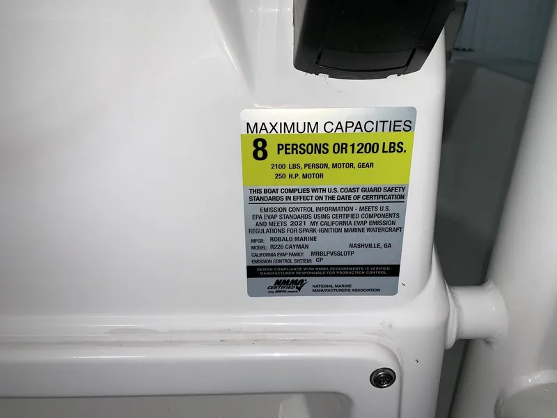 Slide: The Image of 2024 Robalo 226 Cayman capacity label, 8 persons or 1200 lbs, 250 HP motor. - 14