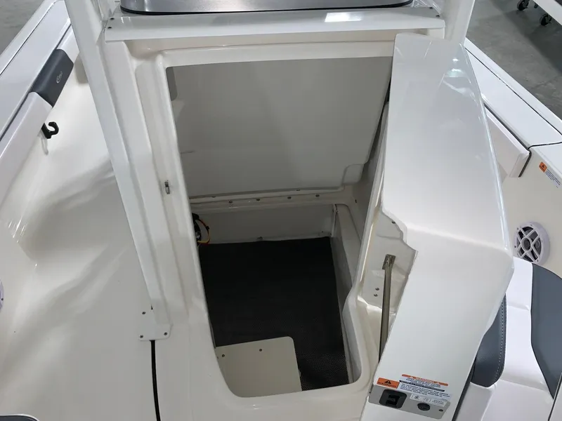 Slide: The Image of 2024 Robalo 226 Cayman boat interior storage compartment. - 23