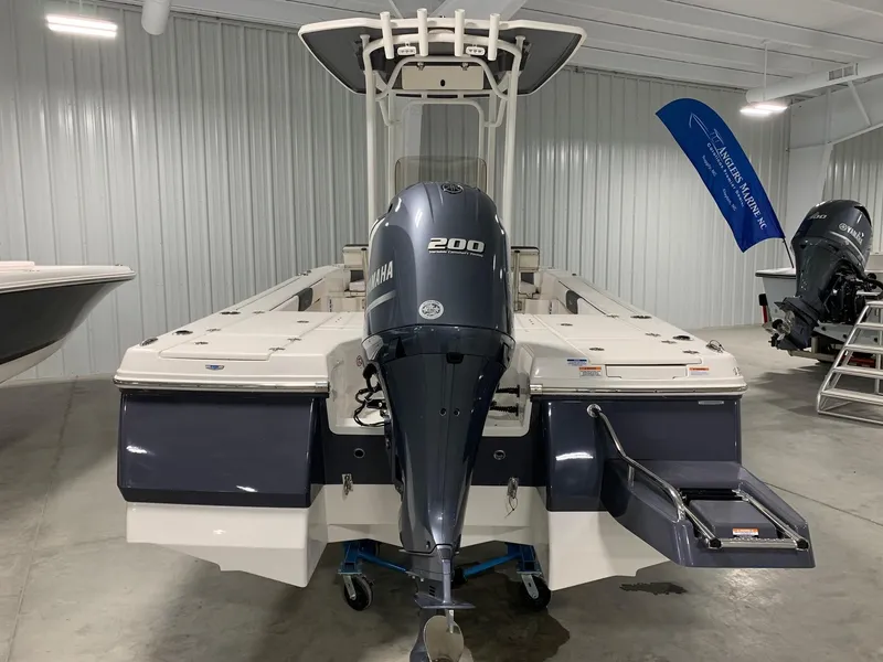 Slide: The Image of 2024 Robalo 226 Cayman boat with Yamaha 200 engine in showroom. - 4