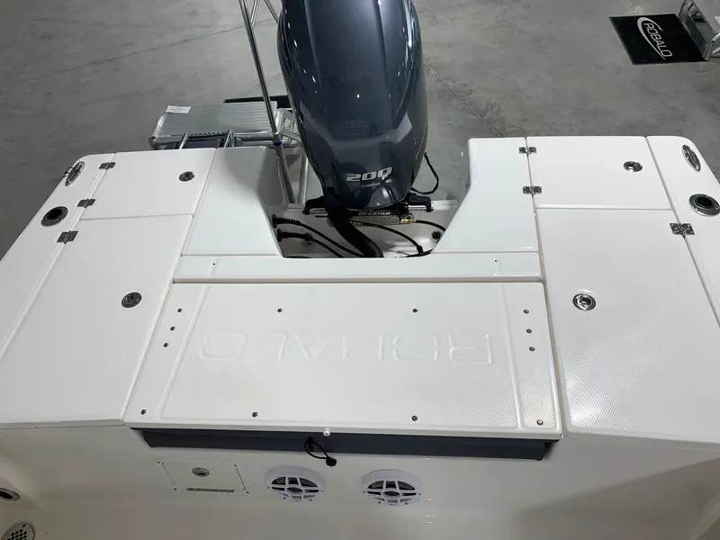 Slide: The Image of 2024 Robalo 226 Cayman boat with 200 HP engine, rear deck view. - 10