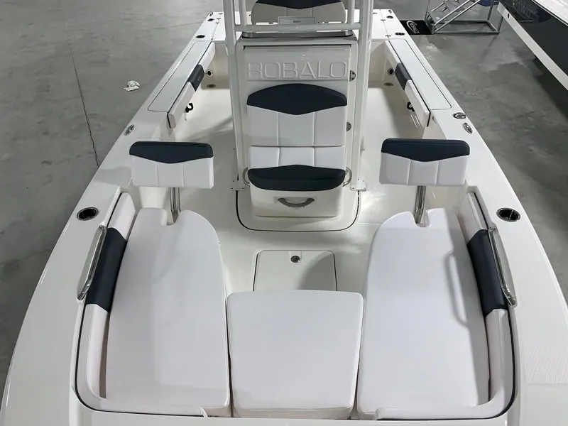 Slide: The Image of 2024 Robalo 226 Cayman boat interior with white and black seating. - 19