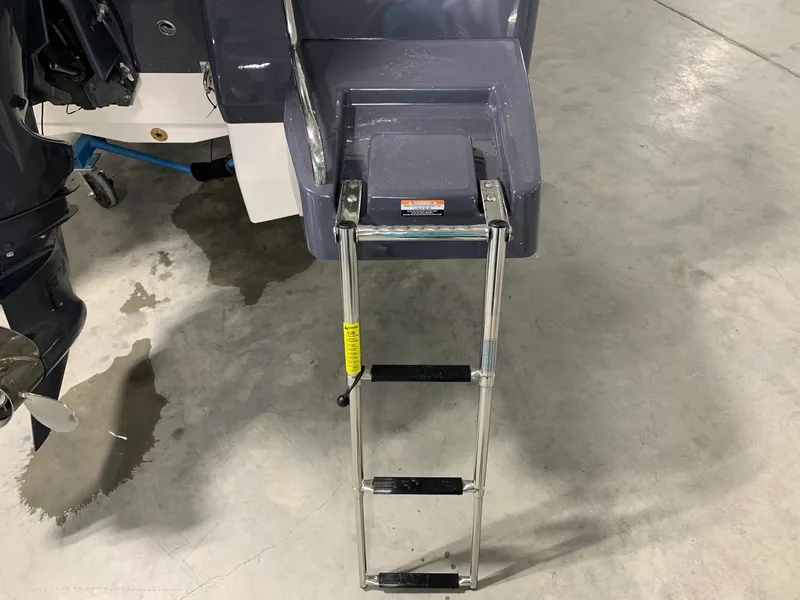 Slide: The Image of 2024 Robalo 226 Cayman boat with extended swim ladder. - 4