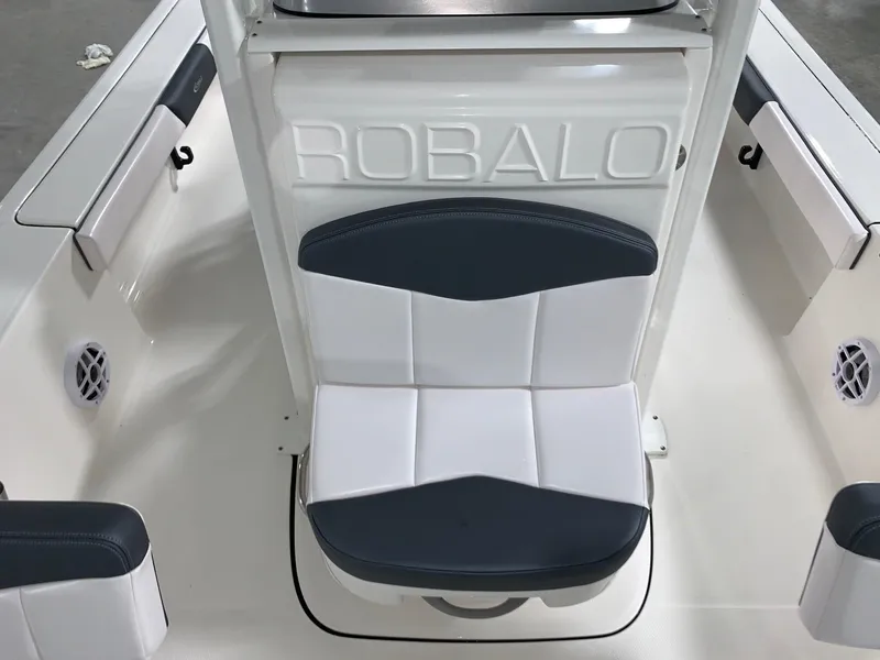 Slide: The Image of 2024 Robalo 226 Cayman boat interior with cushioned seating. - 6