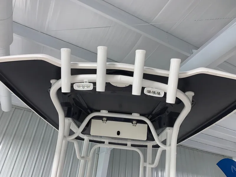 Slide: The Image of 2024 Robalo 226 Cayman T-top with rod holders and LED lights. - 7