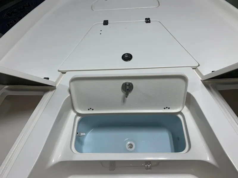 Slide: The Image of 2024 Key West 250 Bay Reef boat livewell and storage compartments. - 17