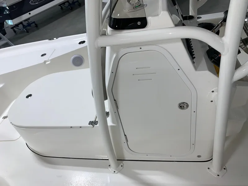 Slide: The Image of 2024 Key West 250 Bay Reef center console and storage compartment. - 29