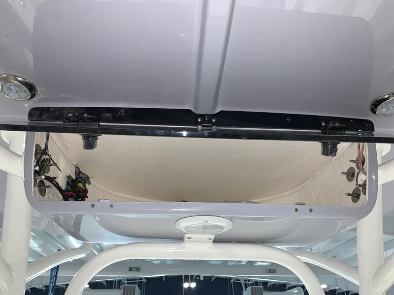 Slide: The Image of 2024 Key West 250 Bay Reef boat interior electronics compartment. - 30