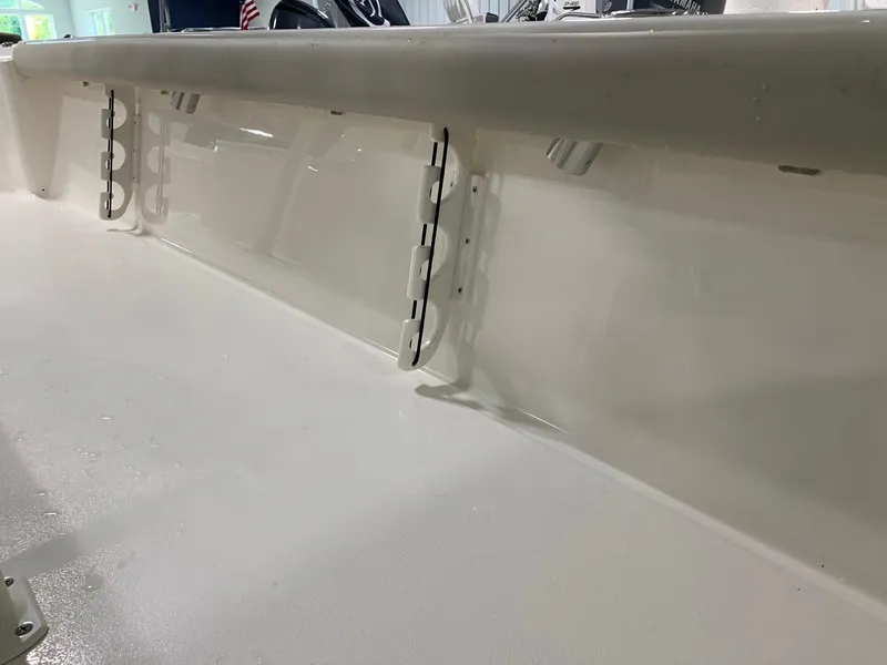 Slide: The Image of 2024 Key West 250 Bay Reef boat interior detail showing rod holders. - 33
