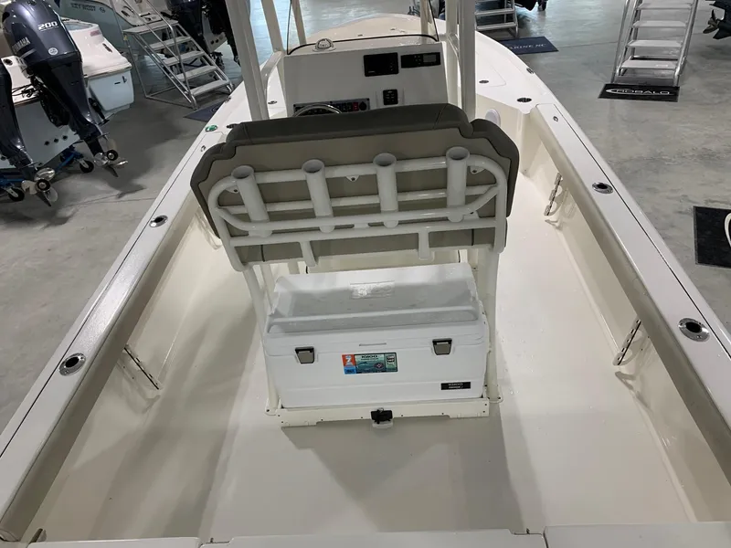 Slide: The Image of 2024 Key West 250 Bay Reef boat interior with seating and storage. - 6