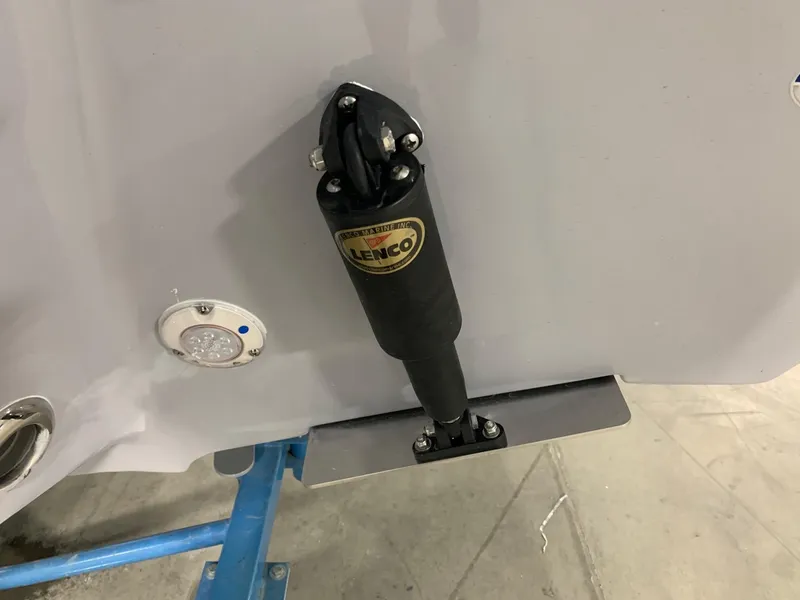 Slide: The Image of 2024 Key West 250 Bay Reef boat with Lenco trim tab actuator. - 3