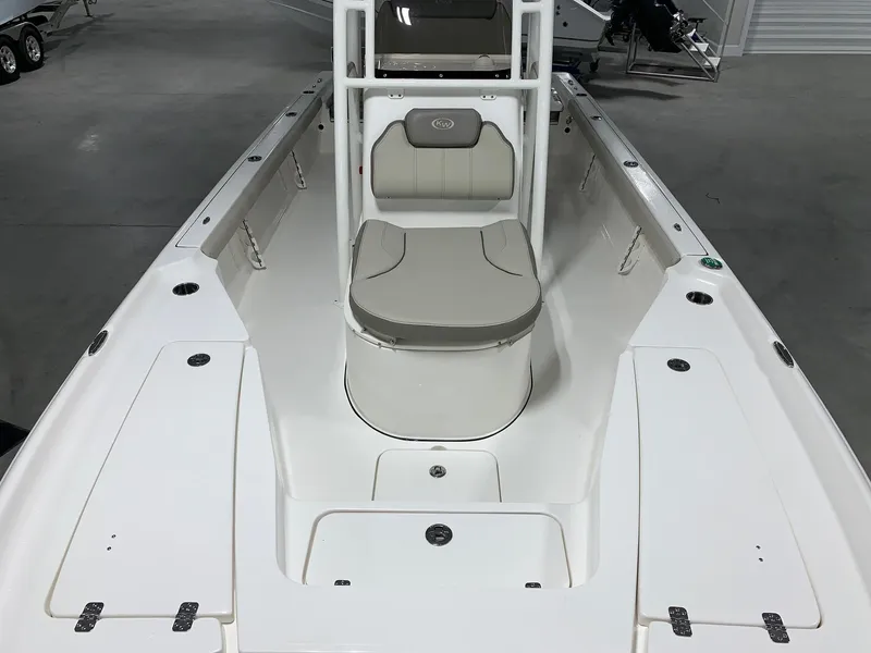 Slide: The Image of 2024 Key West 250 Bay Reef boat interior, front seating and storage compartments. - 6