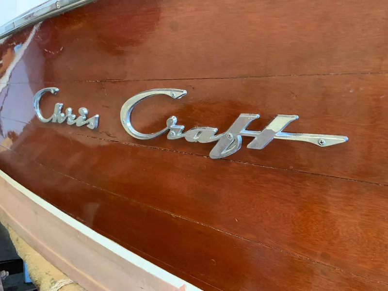 Slide: The Image of 1947 Chris-Craft 17 Runabout Deluxe wooden boat with chrome logo detail. - 10