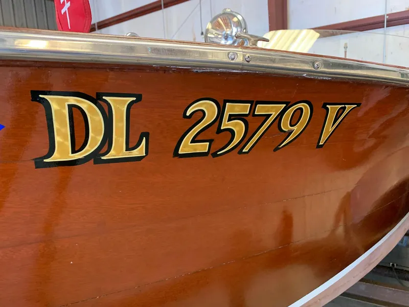 Slide: The Image of 1947 Chris-Craft 17 Runabout Deluxe with registration DL 2579 V, wooden hull detail. - 23
