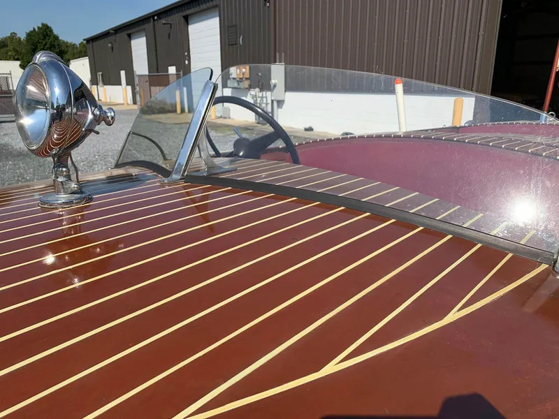 Slide: The Image of 1947 Chris-Craft 17 Runabout Deluxe with polished wood finish and classic design details. - 29