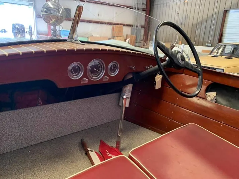 Slide: The Image of 1947 Chris-Craft 17 Runabout Deluxe interior with vintage dashboard and steering wheel. - 6