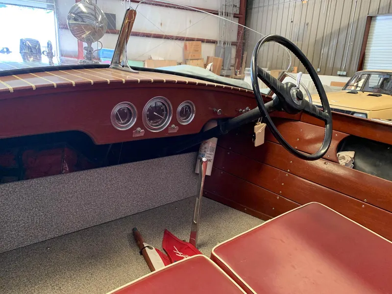 Slide: The Image of 1947 Chris-Craft 17 Runabout Deluxe interior with vintage steering wheel and dashboard gauges. - 9
