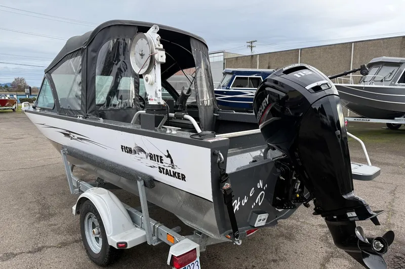 Slide: The Image of 2019 Fish Rite Stalker boat with Mercury outboard motor on trailer. - 27