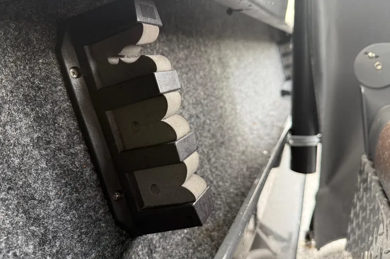 Slide: The Image of Interior view of a 2019 Fish Rite Stalker boat, featuring a mounted rod holder. - 38