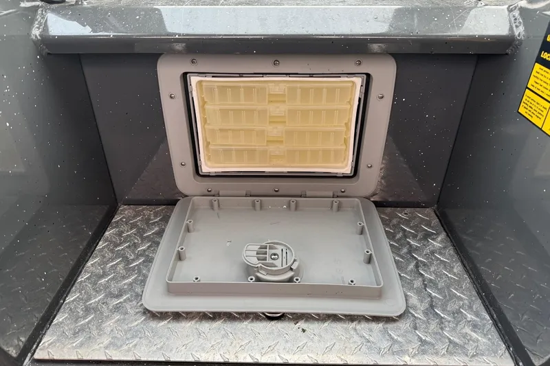 Slide: The Image of 2019 Fish Rite Stalker boat compartment with open hatch on diamond plate flooring. - 41