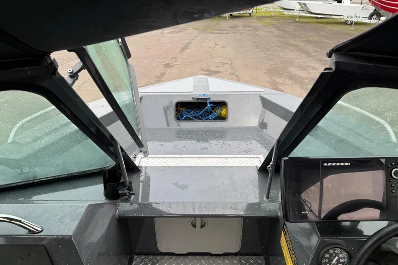 Slide: The Image of 2019 Fish Rite Stalker boat interior with Humminbird electronics and open windshield. - 49